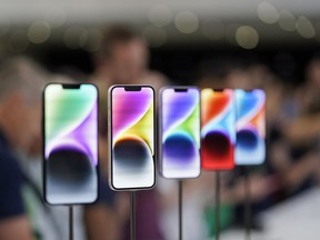 FILE- New iPhone 14 models on display at an Apple event on the campus of Apple's headquarters in Cupertino, Calif., Sept. 7, 2022. Apple Inc. will manufacture its latest iPhone 14 in India, the company said on Monday, as it seeks to curb its production in China.