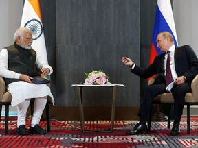 Russian President Vladimir Putin and Indian Prime Minister Narendra Modi attend a meeting on the sidelines of the Shanghai Cooperation Organization (SCO) summit in Samarkand, Uzbekistan Sept. 16.