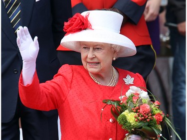 Queen Elizabeth waves as she leaves the stage at the end of the noon hour festivities on Parliament Hill for Canada Day, July 1, 2010.