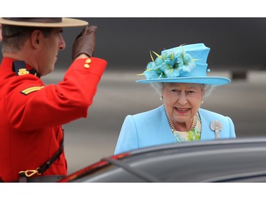 Queen Elizabeth receives a salute from a Mountie upon her arrival at the Ottawa airport June 30, 2010, during a stop on the Royal Tour.