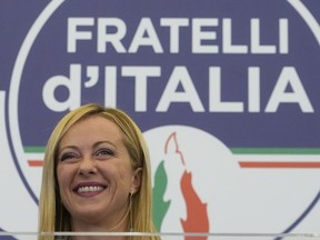 Far-right party Brothers of Italy's leader Giorgia Meloni speaks to the media at her party's electoral headquarters in Rome, early Monday, Sept. 26, 2022.