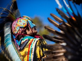 Sixteen-year-old Tristan Dreaver, a grass dancer in his stunning regalia, was getting ready for the grand entry of the powwow at the farm Sunday.