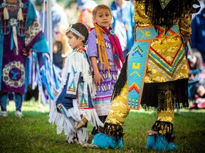 Four-year-old Leo Andrades and six-year-old Leah Andrades were getting prepared for the powwow wearing their grass dancer and jingle dancer regalia.