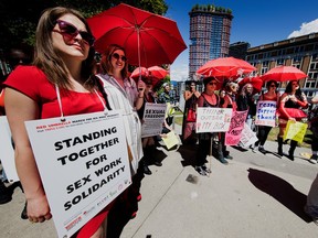 A Red Umbrella March takes place in Vancouver to demonstrate for the rights of sex workers, in this 2018 file photo. Federal legislation is front and center in a court challenge this week.