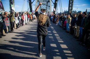 Saturday’s protest started at the National Gallery of Canada and marched to form a human chain stretching the length of the Alexandra bridge.