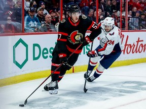 Ottawa Senators centre Shane Pinto (57) eludes the check of Washington Capitals centre Connor McMichael (24) during third period NHL action at the Canadian Tire Centre on October 20, 2022.