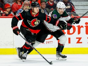 Ottawa Senators left wing Tim Stuetzle (18) and Arizona Coyotes left wing Matias Maccelli (63) during second period NHL action at the Canadian Tire Centre on Oct. 22, 2022.