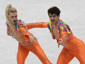 Piper Gilles and Paul Poirier, of Canada, perform in the rhythm dance program at the Figure Skating World Championships in Montpellier, south of France, Friday, March 25, 2022.