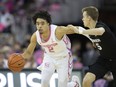 Creighton's Ryan Nembhard (2) drives against Xavier's Adam Kunkel (5) during the first half of an NCAA college basketball game in Omaha, Neb., Saturday, Jan. 29, 2022. Nembhard is among 20 players named as a watch-list candidate for the 2023 Bob Cousy Award, given to the top point guard in college basketball.