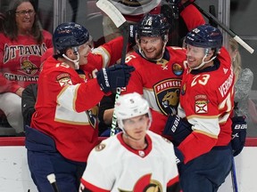 Florida Panthers left wing Matthew Tkachuk (19) helps celebrate a goal against the Ottawa Senators on Saturday.