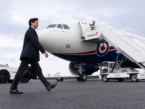 Prime Minister Justin Trudeau walks towards his plane in Ottawa as he leaves on a 10-day international trip on Tuesday, June 21, 2022. THE CANADIAN PRESS/Paul Chiasson