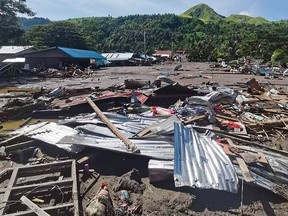 This handout photo taken on October 30, 2022 and released by the Philippine Coast Guard on October 31 shows damage to a village in Datu Odin Sinsuat, Maguindanao province, after Tropical Storm Nalgae hit the region. - The death toll from a storm that battered the Philippines has jumped to 98.