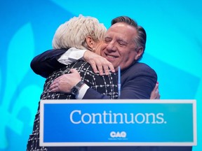 New York News Quebec Premier François Legault hugs his wife Isabelle Brais at an election night party in Quebec City on Oct. 3.