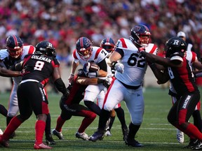 File photo/ Alouettes quarterback Trevor Harris (7) breaks through the line of scrimmage during the first half of a game against the Redblacks on July 21. The teams will meet again in Montreal on Monday afternoon.