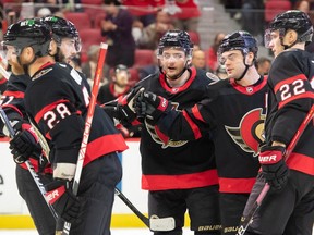 Ottawa Senators right wing Alex DeBrincat (12) celebrates with team his goal scored in the second period against the Montreal Canadiens at the Canadian Tire Centre.