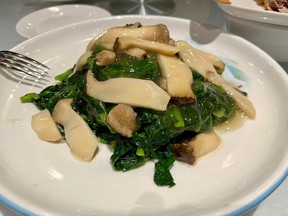 Dine at the restaurant: Peking Duck offers carefully roasted birds and fine Chinese dishes 9 Pea shoots with royal mushrooms.