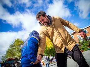 Tom Radford, program manager with the Vanier BIA, plays ‘stick pull’ at Saturday’s Inuit Olympics.