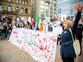 Iranian-Canadians for Justice and Human Rights led the march and rally in Ottawa on Saturday, starting on Wellington Street across from Parliament Hill before descending Elgin Street to the Hall of city of Ottawa.