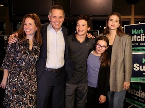 Mark Sutcliffe (along with his wife Ginny and their three children, Erica, 23, Jack, 13 and Kate, 19) celebrates becoming Ottawa's new mayor with a packed house of about 250 supporters at the Lago restaurant in Dow's Lake on Monday in the evening.