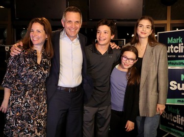 Mark Sutcliffe (along with his wife Ginny and three children, Erica, 23, Jack, 13, and Kate, 19) celebrates becoming Ottawa's new mayor with a packed house of about 250 supporters at Lago restaurant at Dow's Lake Monday evening.