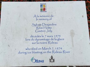 A memorial plaque is mounted near the southeast footing of the Cummings Bridge, near where three City of Vanier employees drowned during ice-blasting night operations on March 7, 1974.