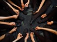 Dancers tie the laces of their dancing shoes before the 2022 World Irish Dancing Championships on its 50th anniversary, in Belfast, Northern Ireland.