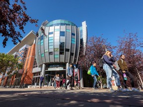 Students walk on the SAIT campus in Alberta.