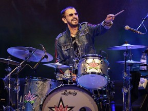 FILE - Ringo Starr plays as part of a concert celebrating the 50th anniversary of Woodstock in Bethel, N.Y., Friday, Aug. 16, 2019. Starr has tested positive for COVID-19, forcing the former Beatle to cancel several upcoming concerts in Canada with his All Starr Band.