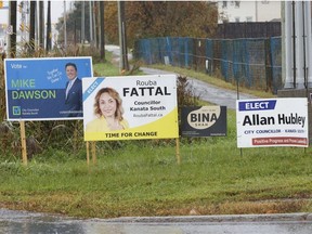 Election signs pictured in the Kanata South ward, where Allan Hubley is seeking re-election against challengers Erin Coffin,  Rouba Fattal, Mike Dawson and Bina Shah.