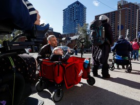 There was a long lineup for Thanksgiving dinner at the Ottawa Mission on Monday. Mark Smith and his son, Quinton, 2, were among those waiting in line.