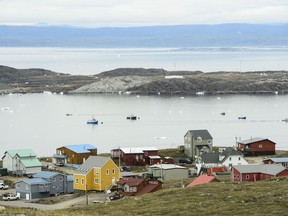 Small boats make their way through the Frobisher Bay inlet in Iqaluit on Friday, Aug. 2, 2019.