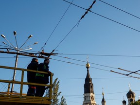 Municipal workers check an electrical network of public transport before possible power outages, amid Russia's attack on Ukraine, in Mykolaiv, Ukraine October 20, 2022.