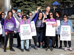CUPE members demonstrate on Eagleson Drive in Ottawa on Nov. 4.