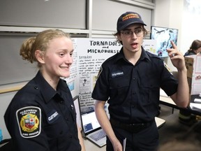 Renée Clutterbuck, left, and Taeg O'Gorman give a presentation on tornadoes and microbursts at Algonquin College on Monday.