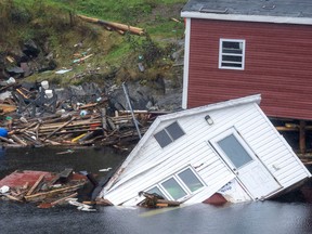 Buildings sit in the water along the shore following the devastation of Hurricane Fiona in Rose Blanche-Harbour le Cou, N.L. on Tuesday, Sept. 27, 2022.