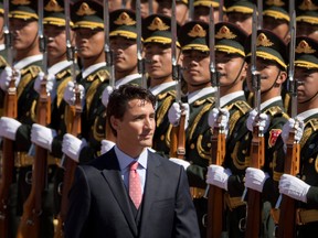 Prime Minister Justin Trudeau reviews a Chinese honour guard at the Great Hall of the People in Beijing,
during a visit in 2016. Foreign influence in our democracy? Everything’s under control, he said this week.