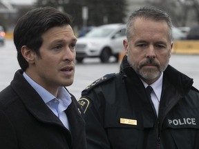 Laval Mayor Stéphane Boyer, left, and Laval police director Pierre Brochet speak to media outside Collège Montmorency on Saturday, Nov. 12, 2022, following the Friday night school lockdown after nearby shootings that left four people injured.