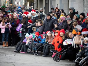 The Help Santa Toy Parade kicked off at City Hall and made its way along Laurier, turning left on Bank Street, and wrapping up at Lansdowne Park, Saturday, Nov. 19, 2022.Spectators lined the streets.