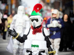 The Help Santa Toy Parade kicked off at City Hall and made its way along Laurier, turning left on Bank Street, and wrapping up at Lansdowne Park, Saturday, Nov. 19, 2022.