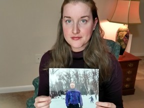 Nancy Marsden with a photo of her late father, Elgin, wearing his favourite ski jacket.