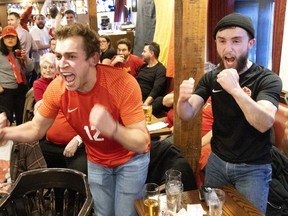 Josh Freed enjoys watching people watch World Cup soccer, he writes, like the fans pictured here at Montreal's Pub Burgundy Lion during Canada's match against Belgium on Wednesday, Nov. 23, 2022.
