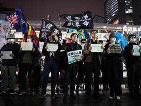 Protesters take part in a rally commemorating victims of China's COVID Zero policy outside Shinjuku Station on November 30, 2022 in Tokyo, Japan. Protesters took to the streets in multiple Chinese cities after a deadly apartment fire in Xinjiang province sparked a national outcry as many blamed COVID restrictions for the deaths.