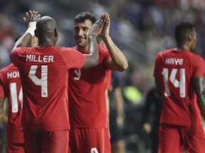 Canada players celebrate after a winning goal during a friendly soccer match against Japan in Dubai, Thursday, Nov. 17, 2022.&ampnbsp;Fans across the country are gearing up for the World Cup kickoff in Qatar and marking the momentous occasion for Canadian soccer by finding time to tune in and communities of fellow fans to watch with.