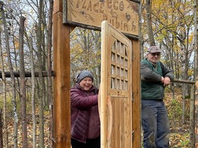 Debbie and Ken Rubin at the door to the Rubin Eco preserve (door by Richard Blais neighbor/artisan/woodworker)