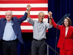 (FILES) In this file photo taken on November 01, 2022 Nevada Governor Steve Sisolak (L), former US President Barack Obama (C) and US Senator Catherine Cortez Masto acknowledge the crowd during a campaign event ahead of the US midterm elections, in Las Vegas, Nevada. - President Joe Biden's Democrats retained control of the US Senate on November 12, 2022.