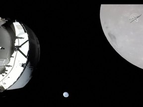 This handout image from NASA released on November 21, 2022, shows a view of the spacecraft, the Earth and the Moon captured by a camera on Orion's solar array wing. - Orion was making its outbound powered flyby of the Moon as part of the Artemis I mission, approaching within 80 miles of the lunar surface.