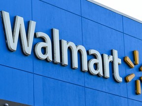 (FILES) In this file photo taken on August 15, 2022 the Walmart logo is seen. A gunman shot and killed multiple people in a Walmart store late on November 22, 2022 in the US state of Virginia, city officials said, adding that the shooter too is dead.