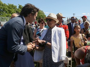 Prime Minister Justin Trudeau speaks with descendants of the 2nd Construction Battalion in Truro, New South Wales, after apologizing on behalf of the Canadian government.