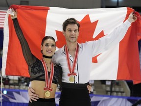 Laurence Fournier Beaudry and Nikolaj Soerensen of Canada pose for a photo celebrating their winning gold in the ice dance free dance program in the Grand Prix of Figure Skating - NHK Trophy in Sapporo, Japan, Saturday, Nov. 19, 2022.