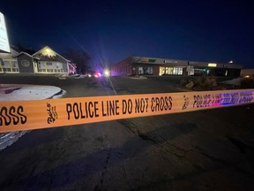 Crime tape is set up near a gay nightclub in Colorado Springs, Colo. where a shooting occurred late Saturday, Nov. 19, 2022.